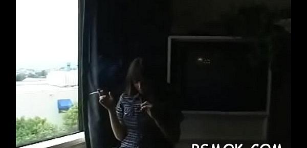  Provacative bitch enjoys some alone time with a cig